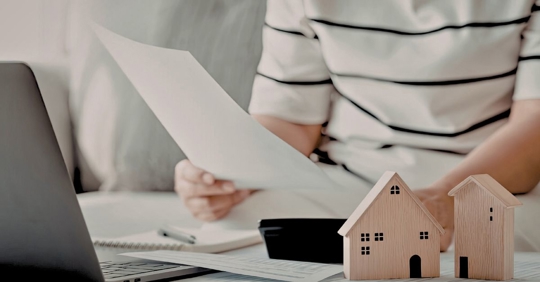 Former homeowner reviewing paperwork